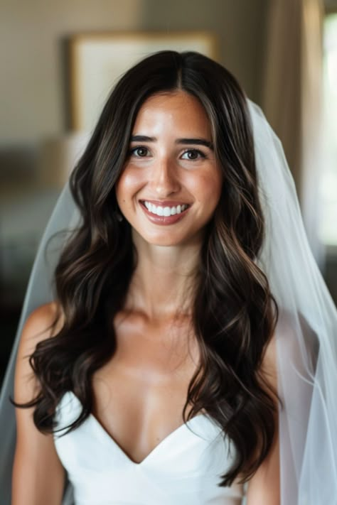 Explore 70+ bridal hair down inspirations for every season. These hairstyles are perfect for brides wanting to wear their hair down on their wedding day. From romantic curls to sleek straight hair, find the perfect bridal hair down look for any season. Simple Wave Hairstyles, Bridesmaid Hair For Beach Wedding, Simple Wavy Wedding Hair, Bride Hairstyles Down Middle Part, Bridal Hair Medium Length Waves, Classic Elegant Wedding Hair, Bridal All Down Hairstyles, Down Wedding Hairstyles Medium Length, Bridal Hair Straight Long