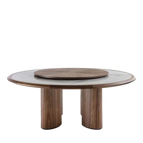 The spontaneous charm of natural materials meets in this table the visual impact of bold geometric volumes. Fashioned of solid Canaletto walnut, the structure boasts a rich grain that can be admired from the elliptic-cut legs to the circular frame where the prized Carrara marble top is nested. A wide lazy susan completes the piece. Please contact the Concierge for size and finishing variants. Table With Lazy Susan, Marble Dining Tables, Geometric Volume, Tulip Dining Table, Circular Frame, Circular Table, Wallpaper Walls Decor, Serving Table, Table Ronde