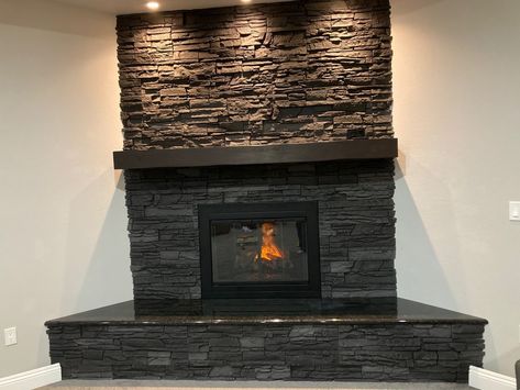 Chadwell decided to brighten up a room in his home with his DIY fireplace design, using our Iron Ore Stacked Stone product to surround the fireplace to make it look even more real. #GenStone #DIY #MyGenStoneDIY #FauxStonePanels Diy Fake Fireplace, Faux Stone Fireplaces, Stacked Stone Wall, Outside Of House, Stacked Stone Fireplace, Installing A Fireplace, Wall Outside, Stacked Stone Panels, Stone Veneer Panels