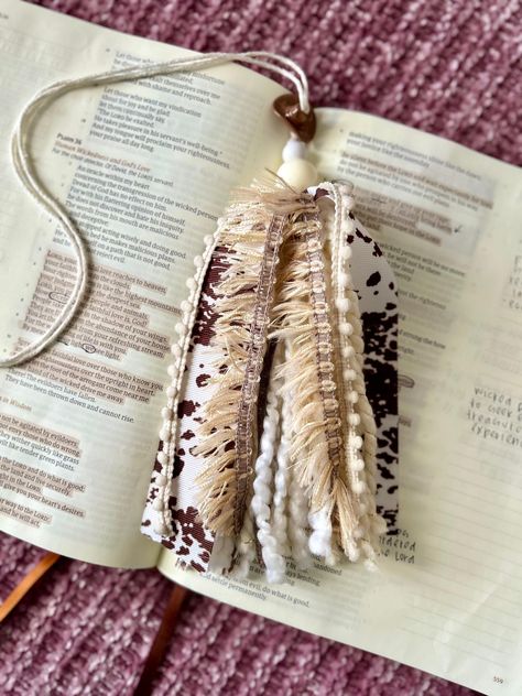 Handmade Bible Tassel full of different yarns and ribbons, topped with beads! This is such a cute way to keep your place in your Bible and makes it unique, too! The bottom bead was left without a knot above it so that you can adjust it to the length of your Bible if needed. Please reach out if you have any questions or concerns :) Bible Tassle Diy, Diy Bible Tassels How To, Diy Bible Tassels, Bookmark Tassle Ideas, Bible Tassel Bookmark Diy, Bookmark Business, Tassle Bookmarks, Bible Tassel, Bible Study Crafts