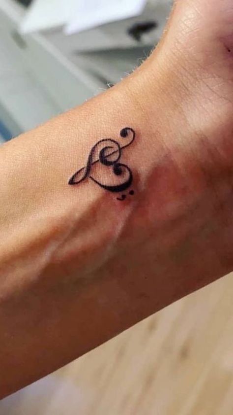 Harmony in Ink: Music notes tattoo ideas. Explore designs that capture the rhythm and melody of your favorite tunes in a timeless and artistic symphony. Music Note Tattoo Ideas, Small Music Tattoos, Notes Tattoo, Small Dope Tattoos, Black People Tattoos, Music Notes Tattoo, Small Girly Tattoos, Power Tattoo, Music Note Tattoo