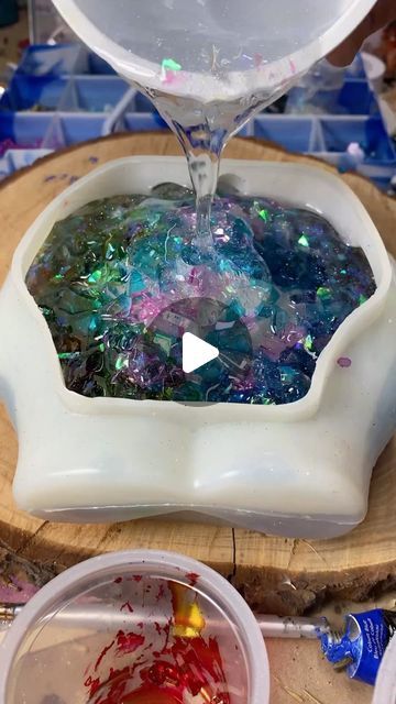 ₡ł₦EŦҤłλ on Instagram: "What do we think about this rainbow glass in this mold?? I dyed this broken glass with alcohol inks first and then strategically placed them in a 🌈 .  I used some iridescent chunky glitter and some magic silver glitter from @crownmade_ (it’s my favorite glitter EVER) in the resin.  I then put it in the pressure pot overnight to get rid of any bubbles.  .  . . . . #resinart #resinfordecor #resin #resindish #diyresin #resinartwork #resinartist #epoxy #epoxyresin #epoxyresin #epoxyresinart #siliconemolds #cuppedhands #rainbow #rainbowart #rainbowaesthetic #asmr #sosatisfying #demolding #unmolding #demoldingvideo #unmoldingvideo #functionalart #artist #chunkyglitter #glitterinresin #glitter" How To Put Paper In Resin, Epoxy Gifts For Men, Liquid Glass Projects, Amazing Resin Ideas, Epoxy Projects Diy, Resin Crafts Tutorial Videos, Resin Molds Ideas, Epoxy Resin Crafts Ideas, Epoxy Resin Crafts For Beginners