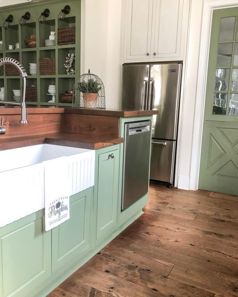 Green kitchen cabinets Farmhouse Green Kitchen Cabinets, Rustic Kitchen Green Walls, Cabin Green Kitchen Cabinets, Green Cabin Kitchen Cabinets, Green Cabinets Kitchen Rustic, Sage Green Stained Kitchen Cabinets, Green Cabinet Wood Countertop, Green Kit Hen Cabinet, Refacing Kitchen Cabinets