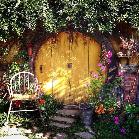 ⌂ Hobbit Homes ⌂ One of my favorite hobbit holes...the yellow one at the start of the tour. | by Yes to Adventure Case Sotterranee, Hobbit Door, Casa Hobbit, Yellow Door, Hobbit Hole, Small Backyard Gardens, Hobbit House, Kid Rock, Fairy Doors