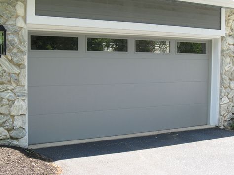 flush panel garage door with windows in grey Flush Panel Garage Door, Garage Door With Windows, Grey Garage Doors, Grey Garage, Slide Gate, Garage Door Replacement, Garage Door Windows, Garage Door Panels, Modern Garage Doors