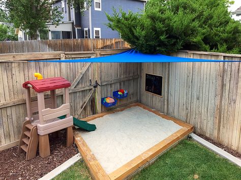 Corner Sandbox Ideas, Backyard Playground With Sand, Big Sand Box Ideas Play Areas, Sand Box Backyard, Backyard Sandbox Ideas For Kids, Backyard Corner Play Area, Sandbox Shade Ideas, Kids Sandbox Ideas Backyards, Kid Friendly Small Backyard Ideas