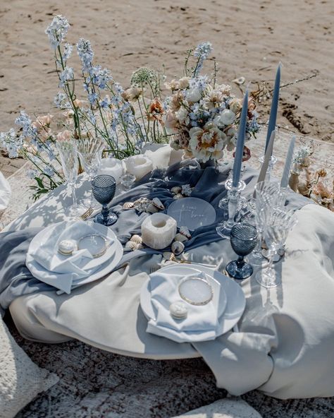 Looking for something blue? Finding something blue for wedding is a tough task...because there is so many lovely options! Check out our article to browse the special blue touches you can make to your wedding ceremony, wedding dress, or wedding decor. Something blue before I do? Sounds good to us! A wedding table on the beach adorned with blue and pink flowers, blue tapered candles and blue tableware Teal And Tan Wedding, Blue Tapered Candles, Beach Wedding Table Settings, Coastal Wedding Theme, Something Blue Ideas, Blue And Peach Wedding, Ceremony Wedding Dress, Sand Diego, Blue For Wedding