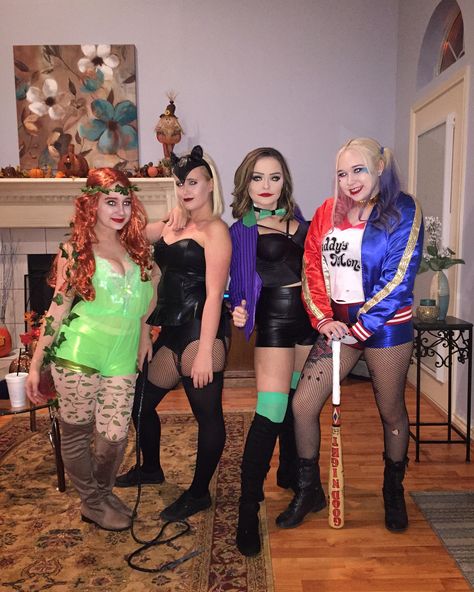 Gotham city costume. Poison ivy, cat woman, the joker, and Harley Quinn take on the world. Group costumes Dc Villain Costumes, Dc Trio Costumes, Cat Woman And Poison Ivy Costumes, Hero And Villian Costume, Joker Group Costume, Trio Halloween Costumes Villains, Trio Halloween Costumes Joker, Héros And Villians Costume Ideas, Dc Group Costumes