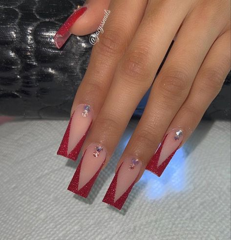 Red And Bling Nails, Red French Tip Nails Coffin With Design, Red Nails Mid Length, Nails Inspo For Red Dress, Red Tapered Square Nails Medium, Red Prom Heels Sparkle, Red V Shape French Tip Nails, Black Rhinestone Nails Short, Red Acrylic Nails Designs Prom