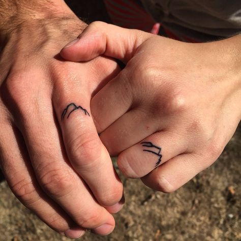 Mountain Ring Tattoo, Tattoo Ideas Mountains, Wedding Rings Tattoo, Wedding Ring Tattoo Ideas, Couple Ring Finger Tattoos, Ring Tattoo Ideas, Mountain Rings, Mountain Wedding Ring, Small Traditional Tattoo