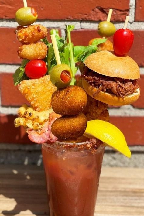 A delicious 24 oz Bloody Mary topped with all of the State Fair Favorites! 3 skewers of Fair Food Treats like Waffle Fries, Deep Fried Cheese Curds, Deep Fried Mac n Cheese, Mini Corn Dogs, Bacon, Fried Pickles, and a BBQ Pulled Pork Slider! State Fair Foods, Nc State Fair Food, State Fair Funnel Cake Recipe, Deep Fried Fair Food, Deep Fried Cheese Curds, Mini Funnel Cakes, Fried Mac N Cheese, State Fair Corn Dogs, Corn Dog Batter