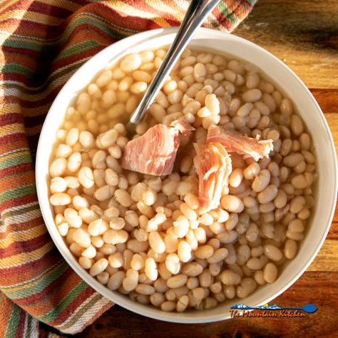 This easy navy beans recipe slow cooks navy beans seasoned with smoky ham into a rich, creamy pot of beans. A hearty meal on a cold day! Beans Recipe Mexican, Great Northern Bean Recipes, Crockpot Bean Soup, Navy Beans Recipe, Northern Bean Recipes, Navy Bean Recipes, Ham Hocks And Beans, Beans Recipe Crockpot, Pot Of Beans