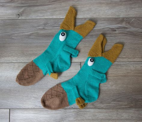 Emma Bermudez is constantly one-upping herself with her fun novelty socks patterns! Check out her Crikey Crocodile Socks, her Catch O’ The Day Socks, and her We Be Dragon socks are amazing too. Her Agent P socks are perfect for Phineas and Ferb fans – aren’t they great? Get the pattern via Etsy, designed by […] Knitting Pattern Socks, Crocodile Socks, Dragon Socks, Fish Socks, Unique Knitting Patterns, Modern Knitting Patterns, Animal Socks, Baby Sweater Knitting Pattern, Here Be Dragons