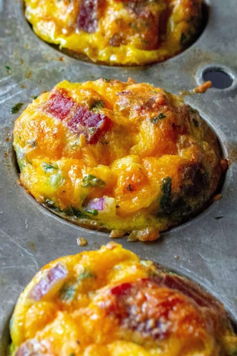 Keto Bacon Egg Muffins are low in carbs and high in protein and packed with tons of bacon, cheese and sausage.  The perfect muffin tin eggs, these Keto Bacon Egg Muffins are fun to make, super tasty and the best easy low-carb keto breakfast on the go. | A Wicked Whisk #breakfastmuffins #breakfasteggmuffins #eggmuffincups #healthyeggmuffins #lowcarbeggmuffins #ketobreakfast #ketoeggmuffins #lowcarbbreakfast #lowcarbeggcups #ketoeggmuffinsbacon #ketoeggmuffinssausage #baconeggmuffins Keto Breakfast On The Go, Muffin Tin Eggs, Low Carb Egg Muffins, Bacon Egg Muffins, Breakfast Egg Muffins, Keto Muffins, Keto Bacon, Egg Muffins Breakfast, Food Keto