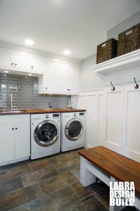 Custom Mudroom and Laundry Room Combo with White Cabinetry and Wainscoting slate floors and Walnut wood Countertops and Bench - Stunning! #mudroom Laundry Room Countertop, Laundry Room/mudroom, Laundry Room/mud Room, Dream Laundry Room, Mudroom Laundry Room, Laundry Room Remodel, Laundry Room Inspiration, Slate Flooring, Small Laundry