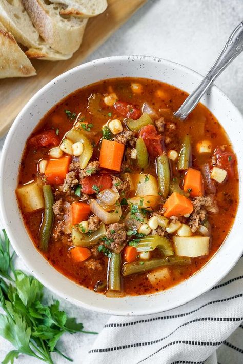 This Vegetable Beef Soup has that simmered-all-day flavor, but it’s ready in less than thirty minutes! This recipe uses ground beef for quick cooking, loads of veggies, all cooked in a savory broth that includes the powerhouse “secret” ingredient–V8 Juice!!!! Healthy and comforting, this soup is a must-make this fall and winter! This recipe is one of those old-fashioned “gramma” recipes (I’ve also seen it be called “Hamburger Soup”). It was actually inspired by a vegetable beef soup… Soup With V8 Juice, Easy Vegetable Beef Soup, Easy Shrimp Scampi Recipe, V8 Juice, Juice Healthy, Winter Soup, Scampi Recipe, Easy Vegetable, Vegetable Beef Soup