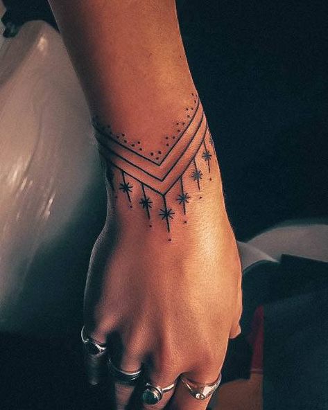 Wrap Tattoos For Women Arm, Minimalist Arm Band Tattoo Women, Womens Band Tattoo, Western Bracelet Tattoo, Bracelet Hand Tattoo, Wrap Around Wrist Hand Tattoo, Boho Finger Tattoos For Women, Women With Arm Tattoos, Ornamental Wrist Cuff Tattoo