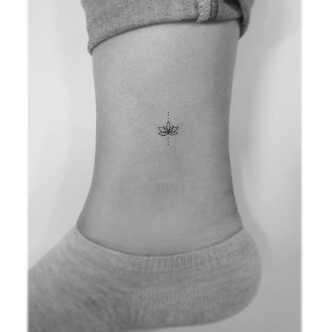 Fine line lotus flower tattoo located on the ankle. Small Buddhist Tattoo, Tiny Lotus Tattoo, Bishop Tattoo, Lotus Flower Tattoos, Small Lotus Tattoo, Flowers Lotus, Buddhist Tattoo, Explore Tattoo, Buddha Tattoo