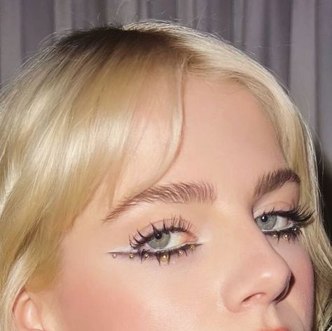 Doniella Davy on Instagram: "My favorite look that I did on @lucyboynton1 for her @greatesthitsmovie press tour! You know how if you’re wearing all black and you add jewelry to your outfit it just breaks up the black and kind of MAKES the whole outfit? Now take that concept and apply it to EYE MAKEUP. See how the gold metallic pearls break up that Smokey black liner and elevate the whole look!?  Check out a new film I did the makeup for: @greatesthitsmovie streaming now on @hulu and look out for some whimsically eccentric makeup looks I created using all @halfmagicbeauty — duh! Stay tuned to learn more about the @halfmagicbeauty bundles I curated featuring the ACTUAL products I used in the film, so you can recreate the looks at home! More coming soon! 🎬💔🔮" Doniella Davy, Eccentric Makeup, Nature Makeup, Wearing All Black, Black Liner, Press Tour, Makeup Inspiration, Stay Tuned, Natural Makeup