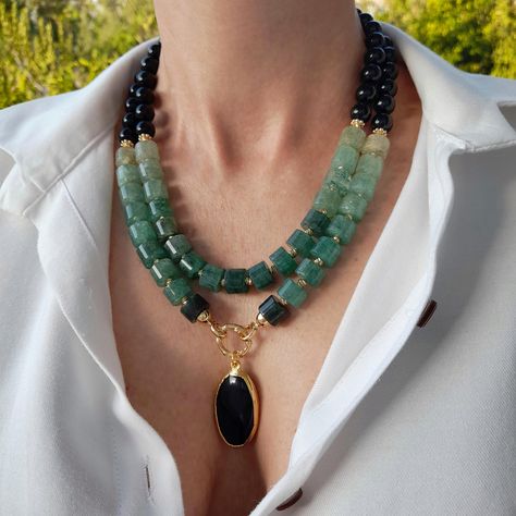 Large cylinder bead green aventurine and black onyx necklace with oval pendant. Big stone beaded necklace. Chunky statement gemstone necklace for women. Large handmade necklace with big bead and gemstone. Big bold bohemian bright necklace in gold color are suitable for an casual look, evening look and for a holiday. These necklace will be a good Christmas, anniversary, wedding or birthday gift for mom, wife, girlfriend, sister or daughter. Women's necklace with natural stone. It emphasizes the beauty of your neck and adds charm to your look. FAST FREE SHIPPING   EARRINGS AS A GIFT   https://www.etsy.com/shop/VesnekaBijou?ref=seller-platform-mcnav§ion_id=24522904 You can see even more necklace here. Dimensions: The necklace has a length of 45-50 centimeters. Structure: Aventurine, onyx,  pe Big Bead Necklace, Statement Gemstone Necklace, Bold Bohemian, Bright Necklace, Large Bead Necklace, Chunky Bead Necklaces, Beaded Jewelry Necklaces, Women's Necklace, Necklace With Pendant