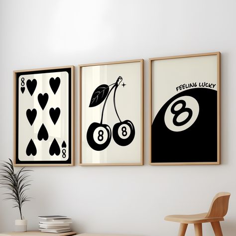 About our: 8 Ball Lucky 3 Poster Pack, Trendy 8 Retro Print Black Apartment Decor, Black Vintage 8 Pool Ball Print, 8 Ball Cherries, 8 of Hearts Print: Elevate your space with our 8 Ball Lucky 3 Poster Pack, featuring a sleek and stylish black theme perfect for trendy and retro decor lovers. This set includes Trendy 8 Retro Print Black Apartment Decor, a Black Vintage 8 Pool Ball Print, and the unique 8 Ball Cherries and 8 of Hearts Print. These black trendy 3 prints combine the iconic 8 pool ball with cherries and vintage card imagery to create a bold and lucky aesthetic. Perfect for black retro wall art enthusiasts, this 8 Lucky Black Poster set brings a touch of nostalgia and style to any room. Whether you're decorating with a black retro decor theme or looking for eye-catching 8 card b Eight Ball Room Decor, Etsy Home Decor, Magic 8 Ball Aesthetic, 8 Ball Painting, Black Apartment Decor, 8 Ball Art, 8 Ball Poster, Apartment Decor Black, 8 Pool Ball