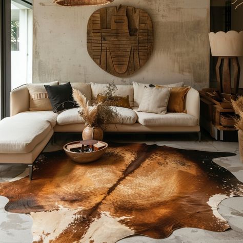 Elevate your space with our luxurious cowhide rugs, adding texture and sophistication to any room. Discover the timeless elegance of cowhide today! #CowhideRugs #LuxuryLiving Living Room With Cow Rug, Cowhide Interior Design, Layering Cowhide Rug Bedroom, Cow Rug Under Dining Table, Cowhide Rug Living Room Boho, Cowhide Office Decor, Cow Hide Decor, Brown Cow Rug, Cow Hide Rug Living Room