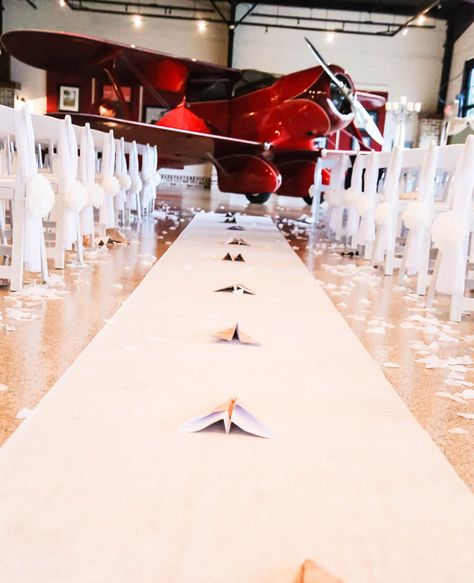 A Paper Airplane Lined Aisle | Blue Dahlia Photography | Blog.TheKnot.com Airplane Hanger Wedding, Plane Wedding, Dahlia Photography, Aviation Wedding Theme, Pilot Wedding, Airport Wedding, Hangar Wedding, Airplane Hanger, Airplane Wedding