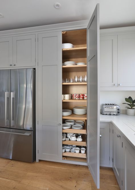 We designed a large crockery cupboard for this Shaker kitchen in London. With three internal drawers and adjustable shelving above, it provides ample storage in this family home. We painted the cabinets in Little Greene's French Grey while the handles are Armac Martin's Kingsheath knobs in satin chrome, matching the stainless steel appliances. Cupboard Door Design, Crockery Cupboard, Painted Shaker Kitchen, Shaker Kitchens, Paint Shakers, Utility Cupboard, Pantry Cupboard, Popular Kitchens, Shaker Kitchen