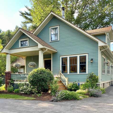 Benjamin Moore Garden Oasis Yellow House White Trim, Brown Windows, Teal Cottage, Craftsman Bungalow Exterior, Board And Batten Exterior, Brown Roof, Blue Shutters, Ranch Exterior, Craftsman Bungalow