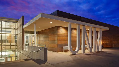 The Gallup Technology Center graces the main entrance to the campus of the University of New Mexico at Gallup. Designed by RMKM Architects, this arresting two-story structure conveys technical sophistication in alignment with the Center’s teaching mission, while also providing comfortable integration with campus life and a deep sense of connection to the surrounding landscape. Extensive use of copper is key to the vision of technology in harmony with people and nature in this award-winning, ... Material Architecture, Coastal Georgia, University Of New Mexico, Building A Fence, Entrance Design, College Campus, Composite Material, Science Center, Entrance Gates