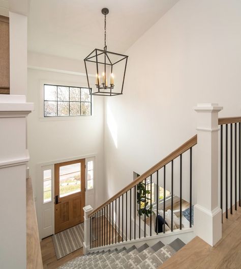 Split Level Railing Ideas Half Walls, Raised Ranch Banister Ideas, End Of Hallway Picture Display, Stair Railing Ideas Modern Farmhouse, Entry Way Pendant Light, Classic Stair Railing Ideas, Stair Chandelier Farmhouse, Bilevel Entryway Ideas, Raised Bungalow Entrance