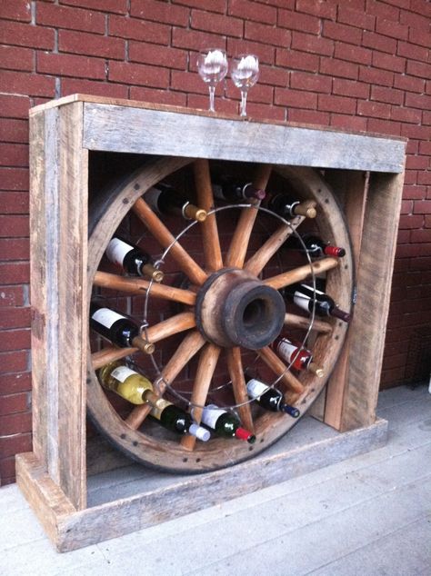 Awesome wine rack made from Tennessee Wood Flooring reclaimed barnwood! Wood Wheel Decor, Wagon Wheel Hat Rack, Wagon Wheel Decor Indoor, Old Wagon Wheel Ideas, Wagon Wheel Decor, Wagon Wheels, Old Wagons, Barn Wood Crafts, Wheel Decor