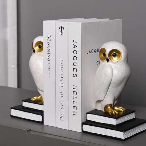 Elevate your bookshelf or desk with these charming Bird Bookends! These beautifully crafted owl bookends are made of high-quality poly-resin, ensuring durability and a polished finish. Each piece stands at just over 7.5 inches, making them the perfect size for adding a touch of whimsy to any space. Pads at the bottom prevent slipping and protect your furniture. These cute, big-eyed owl figures make an ideal gift for owl lovers and a delightful addition to modern home and office decor. Harry Potter Bookends, Owl Figurines, Owl Bookends, Tummy Time Activities, Decorative Bookends, Baby Changing Tables, Bird Book, Little Library, White Owl