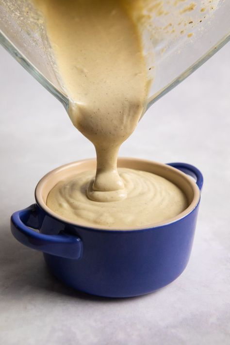 vegan white sauce poured from blender into a blue ramekin Vegan White Sauce, Vegan Bechamel Sauce, Cashew Cheese Recipe, Vegetarian Sauces, Cashew Sauce, Delicious Gluten Free Recipes, Cashew Cream, Bechamel Sauce, Oil Free Vegan