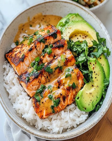 Spicy Salmon Bowls with Coconut Rice topped with pickled cucumber, avocado, and spicy mayo. A delicious, quick, and healthy weeknight meal. Spicy Salmon Bowls With Coconut Rice, Coconut Rice Salmon Bowl, Pescatarian Snacks, Salmon Avocado Rice Bowl, Salmon With Rice, Spicy Bowl, Lunch Board, Salmon Bowls, Avocado Rice