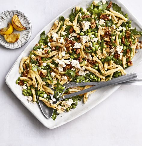 Pasta salad might sound retro, but this fresh take is perfect for a weeknight dinner or as a side at a dinner party. Here, with nutty edamame, toasted walnuts, and crumbled feta, you get something elegant and interesting. Sherry vinegar adds a nice mellow flavor, but you can substitute red or white wine vinegar in a pinch. If you’re making this ahead, leave out the baby arugula until just before serving. Salad With Edamame, Edamame Pasta, Edamame Recipes, Vegetable Pasta Salads, Keto Pasta, Meal Train Recipes, Walnut Recipes, Vegetable Pasta, Pasta Salads