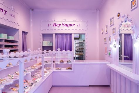 Bakery Selfie Wall, Purple Cafe Interior, Colorful Store Interior, Pop Art Cafe, Purple Coffee Shop, Cookie Branding, Purple Icing, Bakery Branding Design, Cake Shop Design