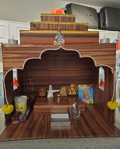 Mandir made with cardboard and adhesive paper which makes the cardboard looks like wood😀 Diy Mandir Ideas Cardboard, Mandir Design, Pooja Mandir, Diy Yarn, Diy Yarn Crafts, Puja Room, Pooja Room, Pooja Rooms, Diy Cardboard