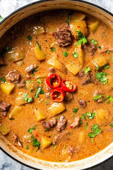 This beef Massaman curry made from scratch is pure comfort food. The rich, fragrant Thai curry is slow-cooked with tender beef chunks, potatoes, smoky chilies, and creamy coconut milk until the meat is tender and the sauce is flavorful. #massaman #thai #curry Beef And Potato Curry, Thai Massaman Curry Recipe, Massaman Beef Curry, Curry Beef Recipes, Masman Curry, Massaman Curry Chicken, West Indian Curry, Beef Curry Recipes, Minced Beef Curry