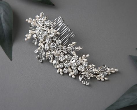 Glamorize your special day with this radiant sparkling wedding hair comb with pearl drops. Reminiscent of a fairy-tale dream, this elegant comb features round and marquise cut crystal stones, delicately accented with ivory pearl drops and crystal-dotted leaves, creating a timelessly mesmerizing effect. Perfect for the modern bride looking to add a touch of elegance and refinement to her look. This side comb measures about 6 inches long and 2 inches high. . #bridalhaircomb #bridalhaircombs #b... Pearl Hair Piece, Sparkling Wedding, Side Comb, Gold Headpiece, Wedding Hair Comb, Sparkle Wedding, Bridal Comb, Vintage Inspired Jewelry, The Modern Bride