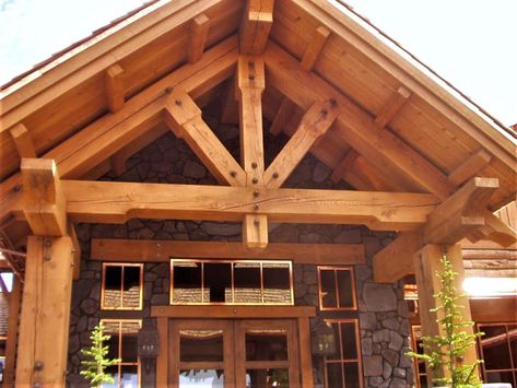 Large timber frame truss over a front entryway. #Cariboucreekloghomes #handcraftedtimber #customtimbers Ranch House Curb Appeal, Timber Frame Exterior, Luxury Log Homes, Modern Log Home, Log Cabin Exterior, Timber Frame Porch, Log Home Builders, Timber Truss, Fixer Upper House