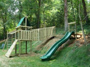 Playground On Uneven Ground, Pit Ideas Backyard, Backyard Ideas Hill Sloped Yard, Backyard Slide On Hill, Sloped Yard Playground, Shaded Play Area Backyard, Landscape Play Area, Slide On A Hill Backyards, Playground On Hill