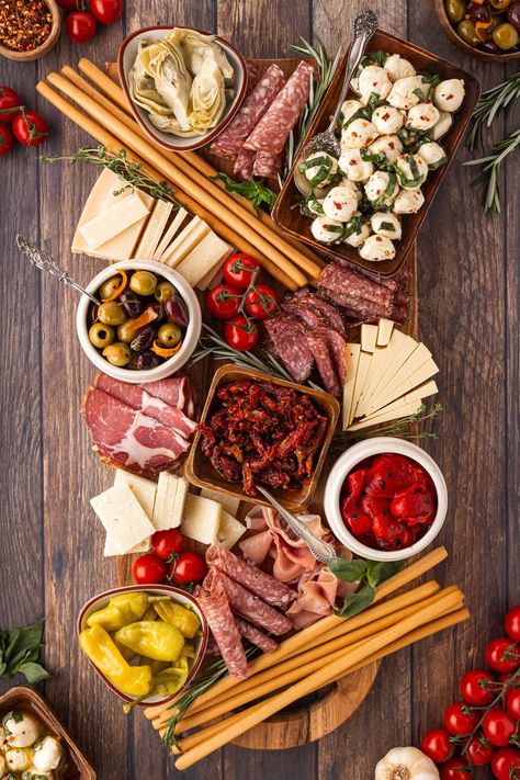 This Antipasto Platter is filled with gorgeous Italian meats, cheeses, vegetables and more. We have also included two easy recipes to make your appetizer rise above the rest. Italian Crudite Platter Ideas, Italian Antipasto Charcuterie Board, Italian Charturie Board, Italian Charcuterie Board Antipasto Platter, Wine Platter Ideas, Italian Themed Charcuterie Board, Meat And Cheese Board Simple, Italian New Years Eve Dinner, Antipasta Platters Italian