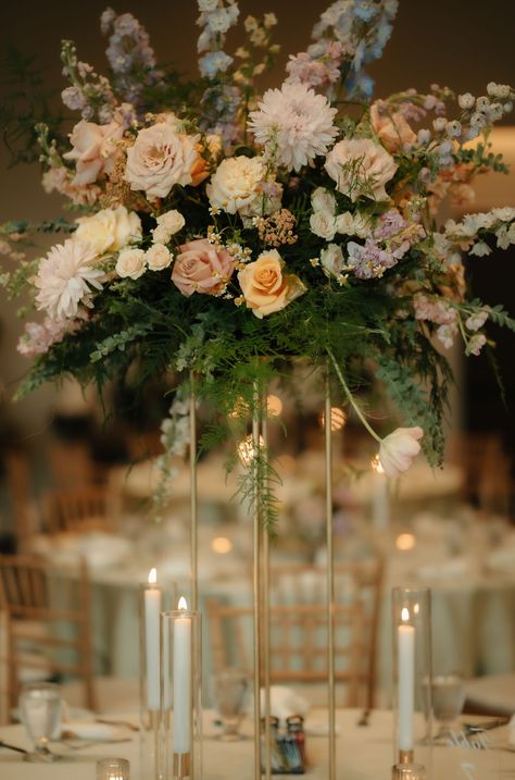 Airy, garden-like pastel tall centerpiece at Tapatio Springs resort | Asparagus fern, acacia, butterfly ranunculus, lisianthus, chrysanthemum, light blue delphinium, lavender delphinium, chamomile, sandy-blush roses, antique pink roses, peach roses, pink larkspur, light peach lisianthus, peach stock | Photo by: Lavender Sage Photography | Volare Planning Blue Delphinium, Lavender Sage, Asparagus Fern, Tall Centerpieces, Spring Resort, Antique Pink, Light Peach, Peach Roses, Blush Roses