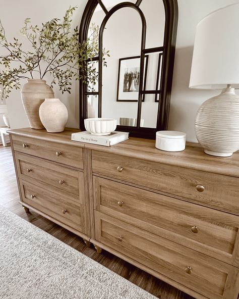 Before moving this dresser into our entryway hallway, I styled it in the front foyer. I loved the simplicity and serenity of the Neutral tones and natural textures create a calming entryway that invites warmth and peace from the moment you step inside. 🌟The first two pictures are what I styled before I decided to switch up the living room. The last three are what I ended up doing. 🤔What are your thoughts? Do you like the final result? Which one is your favorite? #HomeDecorInspo #Neutral... Buffet Table Living Room Decor, Dresser In Entryway Ideas, Clean Lines Living Room, Entryway In Living Room, Dresser In Entryway, Dresser Styling Bedroom, Styled Dresser, Home Entryway Ideas, Dresser Top Decor