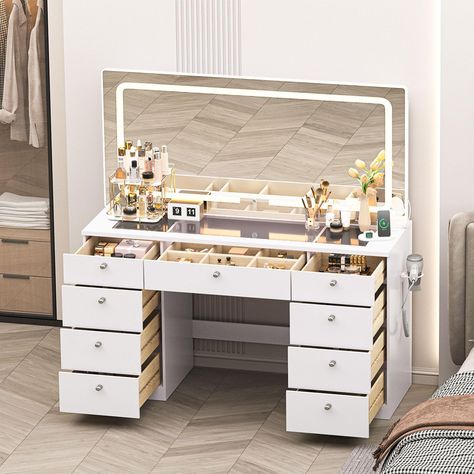 PRICES MAY VARY. 46 INCH MAKE UP DESK Measuring 46.1 inches (L) x 15.8 inches (W) x 55.1 inches (H), this vanity unit has a clear glass table top [46.1 inches (L) x 15.8 inches (W)] with a large mirror to meet all the make-up needs of girls and women LIGHTS ADJUSTABLE Our vanity desk has 3 different colors of light for you to choose from (cold white, warm white, warm yellow) to make you look beautiful easily MULTIFUNCTIONAL TABLE We've designed a charging station and USB port on the desktop for Long Vanity Desk, Vanity Table Ideas, Table With Lights, Vanity Table With Lights, Desk For Bedroom, Modern Dressing Table Designs, Glass Top Vanity, Vanity Desk With Mirror, Multifunctional Table