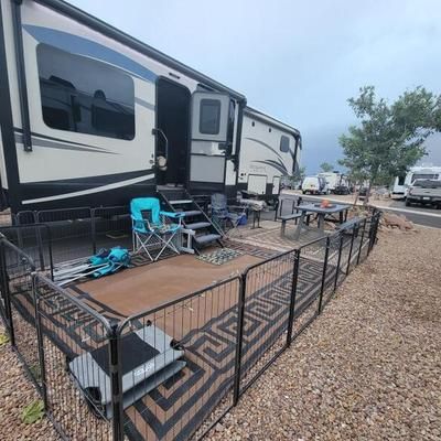 iRV2 - RVing With Dogs Made Easy: An Honest Review Of The... | Facebook Camper Dog Fence, Rv Fence Ideas, Rv Living With Dogs, Rv'ing With Dogs, Camper Carport, Rv Dog Fence, Nomad Living, Camper Organization Rv Living, Rv Dog