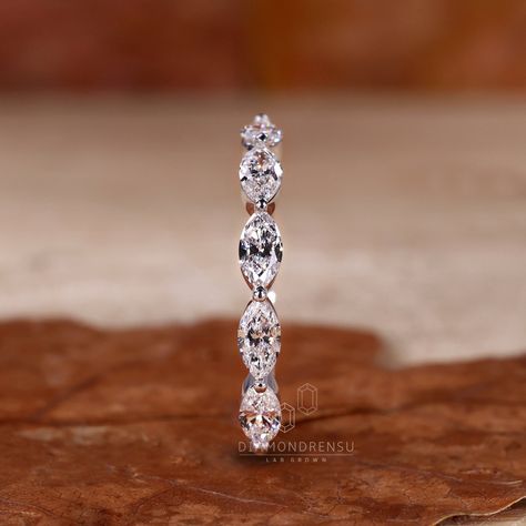 Enhance your wedding set with the Marquise Cut Lab Grown Diamond Half Eternity Wedding Band for Women. Featuring an east to west set marquise lab-created diamond, this matching and stackable band by Diamondrensu adds a touch of elegance and sparkle to your special day. With its exquisite design and ethical sourcing, this wedding band symbolizes everlasting love and commitment. Complete your bridal look with this beautiful handcrafted piece. "𝐓𝐨𝐠𝐞𝐭𝐡𝐞𝐫 𝐰𝐞 𝐜𝐚𝐧 𝐦𝐚𝐤𝐞 𝐭𝐡𝐞 𝐰𝐨𝐫𝐥? Marquee Diamond Wedding Band, Marriage Bands For Women, Wedding Bands Silver Women, Wedding Bands For Marquise Diamond, Marquise Diamond Wedding Band, Mixed Stone Wedding Band, Woman’s Wedding Band, Marquee Wedding Band, Marquise Diamond Band