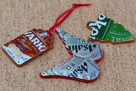 "Upcycle your favorite beer cans into unique Christmas ornaments with this fun and easy DIY project. Using simple materials like wooden shapes, old beer or soda cans, and a few upholstery nails, you can create personalized ornaments that bring rustic charm to your holiday decor. These ornaments are a great way to recycle and make thoughtful gifts, especially for the craft beer lover in your life. You can even use them as gift tags! Whether you're adding to your own tree or looking for a unique Pop Tab Ornaments, Can Decorations, Kids Fathers Day Crafts, Upholstery Nails, Edible Crafts, Valentine's Day Crafts For Kids, Popular Crafts, Thanksgiving Crafts For Kids, Diy Baby Clothes