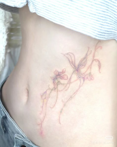 Violet Hip Tattoo, Pastel Tattoos For Women, Body In Abyss Heart In Paradise Tattoo, Light Color Tattoo, Watercolor Tattoo Back, Pastel Flower Tattoo, Pastel Tattoo Ideas, Floral Stomach Tattoo, Light Pink Tattoo